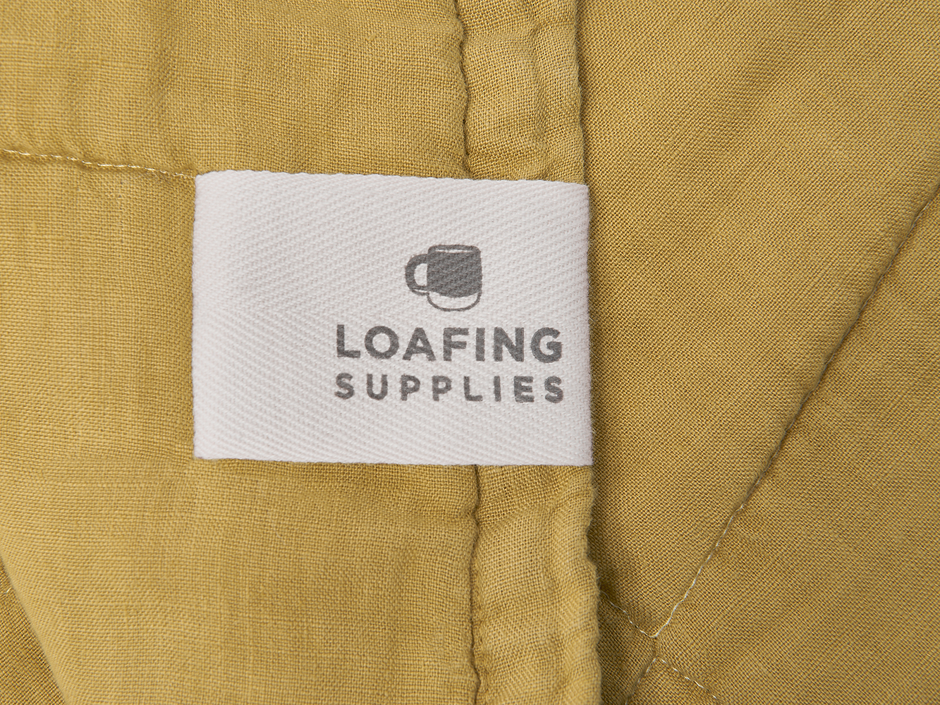 Lazy Quilt in Ochre Comfy Knitted Throw Loaf